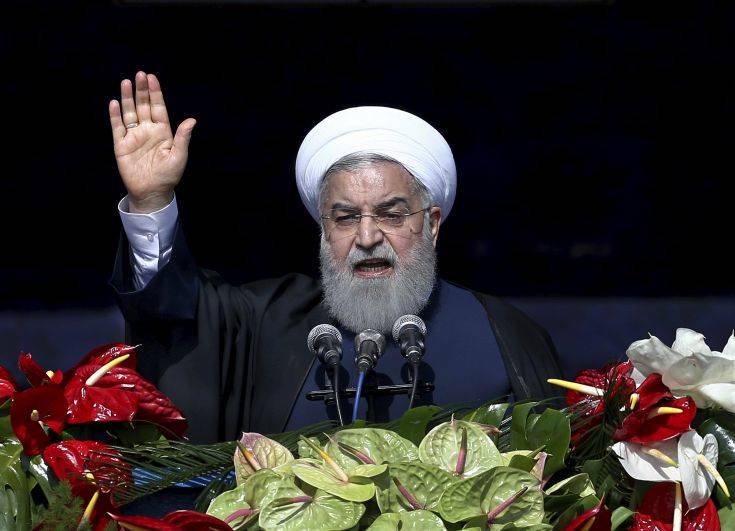 Iranian President Hassan Rouhani delivers a speech during a rally marking the 39th anniversary of the 1979 Islamic Revolution, in Tehran, Iran, Sunday, Feb. 11, 2018. Iranians are on the streets marking the anniversary, just weeks after anti-government protests rocked cities across the country. Demonstrators in Tehran on Sunday chanted traditional slogans against the United States and Israel. (AP Photo/Ebrahim Noroozi)