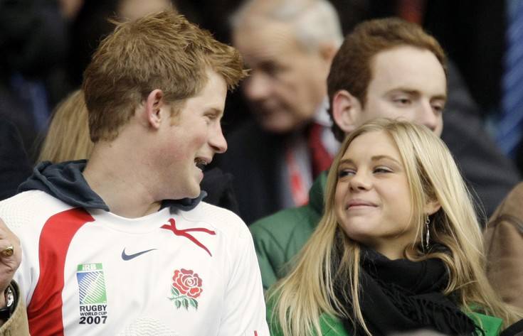 ** FILE ** In this Nov. 22, 2008 file photo Britain's Prince Harry, left, talks to his girlfriend Chelsy Davy, who was born in Zimbabwe, before the international rugby match between England and South Africa at Twickenham stadium in west London. A British tabloid newspaper is reporting that Prince Harry and his longtime girlfriend have broken up. The News of the World reported on its Web site Saturday, Jan. 24, 2009 that the prince, 24, and Chelsy Davy decided to split up after a series of talks last week. (AP Photo/Matt Dunham, File) ** zu APD0555 **